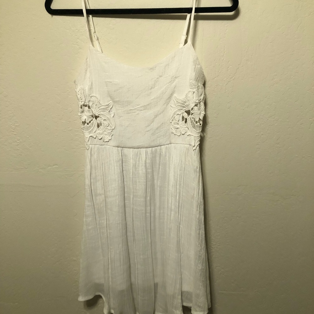 White dress with lace detail cutouts